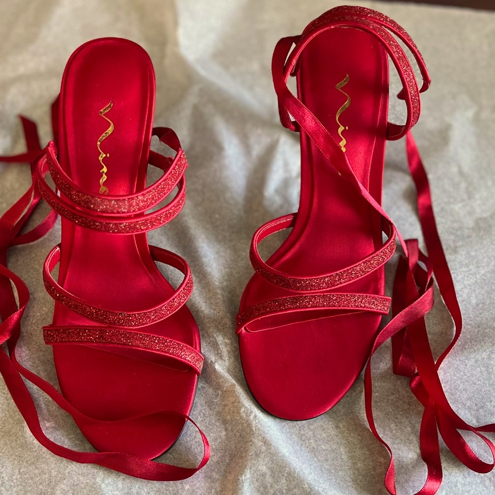 Red strappy heels by Nina